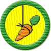 Merit Badge in Motivation
[Click For More Info]

This Badge is yours as part of my Mad March Giveaway, sponsored by the Mad March Hare! Why a carrot - well I guess that hares, like rabbits, like carrots. Now there's a sentence I bet hasn't been used with a merit badge before. Hey, THANK YOU SO MUCH for being a fan, it takes a lot of gumption to stand reading my newsfeed burblings, it is appreciated. You have a great day, and remember even the greatest novels and poems - start with that first line.
